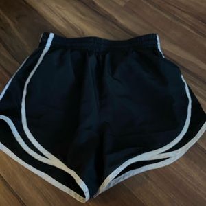 Black workout shorts with white lines